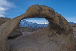 Light on Mount Whitney Mobius Arch in the Alabama Hills framing Lone Pine Peak and Mount Whitney